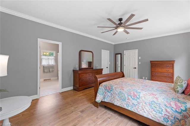 641 Doe Run Dr, Kernersville, NC 27284 - bedroom featuring wood finished floors, crown molding, baseboards, a ceiling fan, and connected bathroom