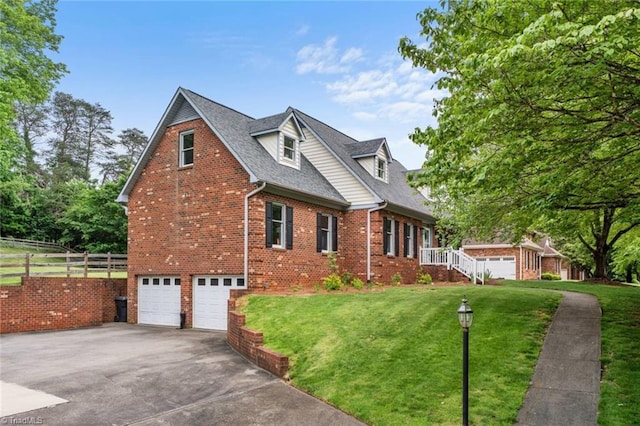 641 Doe Run Dr, Kernersville, NC 27284 - view of front of property with brick siding, asphalt driveway, a garage, and roof with shingles