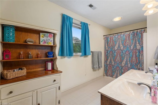 641 Doe Run Dr, Kernersville, NC 27284 - bathroom featuring vanity, a shower with shower curtain, tile patterned flooring, and baseboards