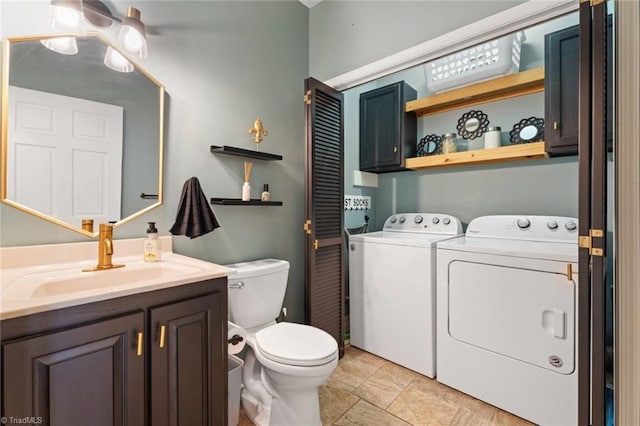 641 Doe Run Dr, Kernersville, NC 27284 - bathroom with separate washer and dryer, toilet, vanity, and stone finish flooring