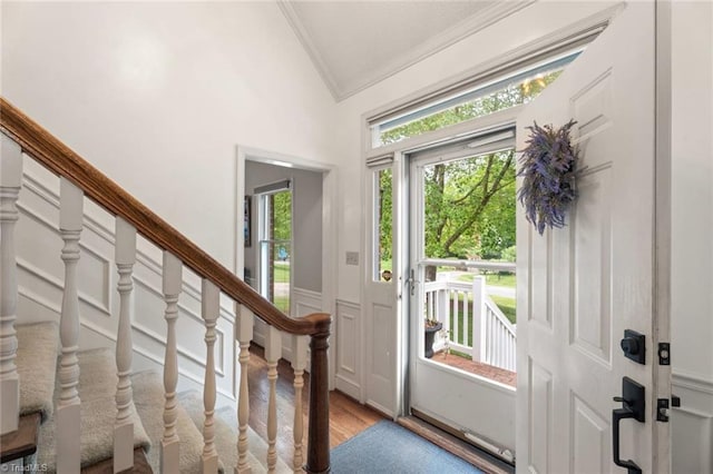 641 Doe Run Dr, Kernersville, NC 27284 - entryway featuring ornamental molding, vaulted ceiling, light wood-style floors, stairway, and a decorative wall