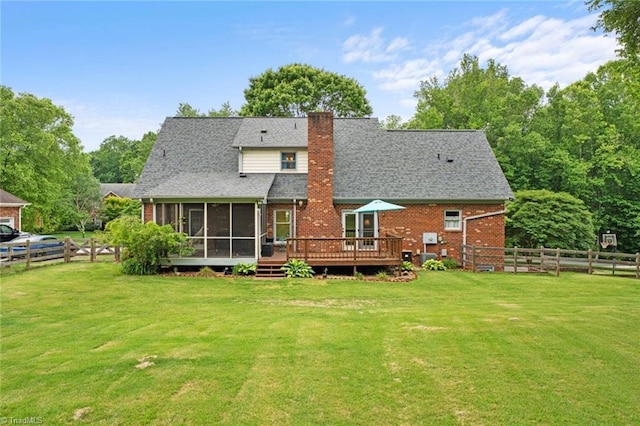 641 Doe Run Dr, Kernersville, NC 27284 - back of house featuring a sunroom, a chimney, a deck, brick siding, and a shingled roof