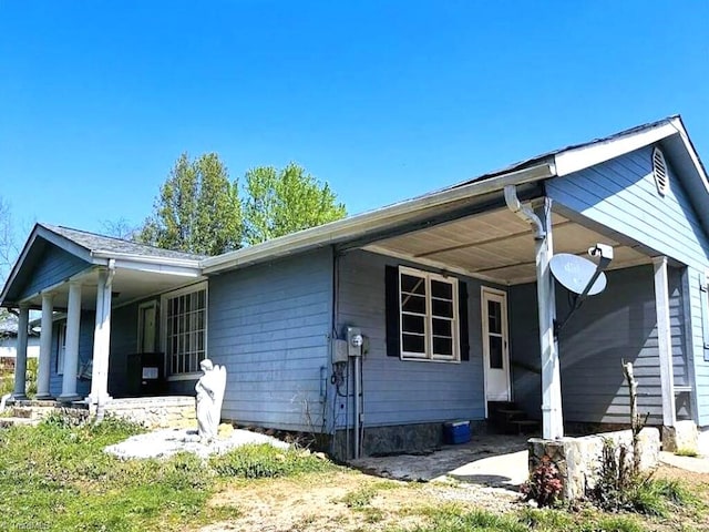 view of property exterior featuring a porch