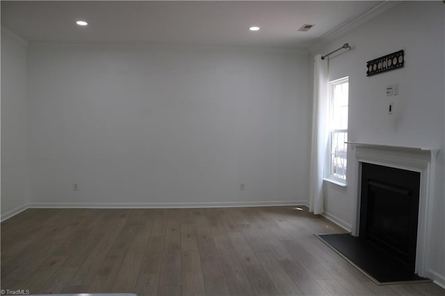 6215 Glen Way Dr, Winston-Salem, NC 27107 - unfurnished living room featuring a fireplace, crown molding, plenty of natural light, wood-type flooring, and recessed lighting