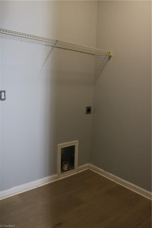 6215 Glen Way Dr, Winston-Salem, NC 27107 - laundry area with electric dryer hookup, dark wood finished floors, and a fireplace
