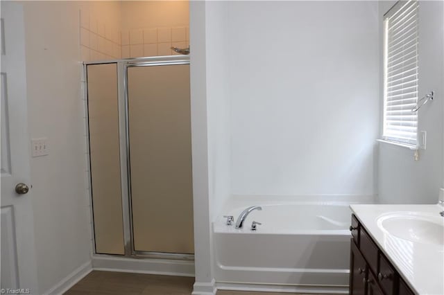 6215 Glen Way Dr, Winston-Salem, NC 27107 - bathroom featuring a stall shower, a bath, and vanity