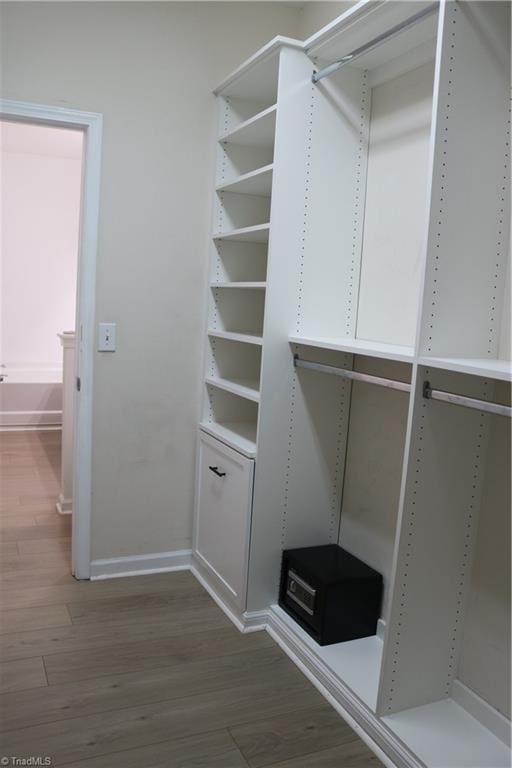 6215 Glen Way Dr, Winston-Salem, NC 27107 - walk in closet featuring wood finished floors
