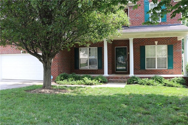 6215 Glen Way Dr, Winston-Salem, NC 27107 - view of front facade with a porch, brick siding, a front lawn, and driveway