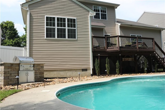 6215 Glen Way Dr, Winston-Salem, NC 27107 - back of house with an outdoor kitchen, a deck, an outdoor pool, and stairs