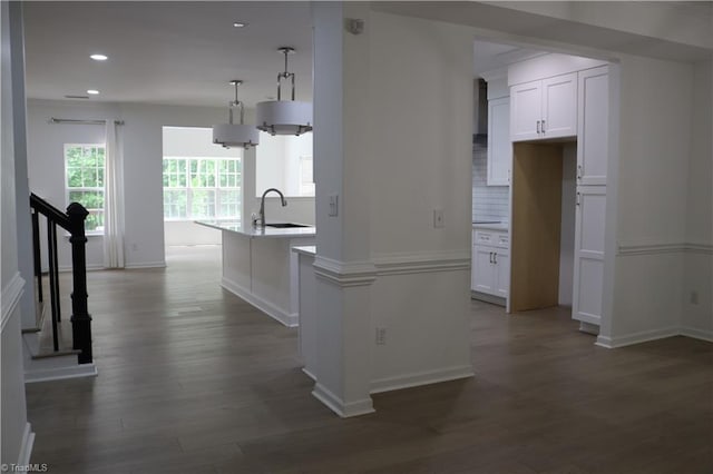6215 Glen Way Dr, Winston-Salem, NC 27107 - kitchen featuring a center island with sink, white cabinets, dark wood finished floors, recessed lighting, and decorative backsplash
