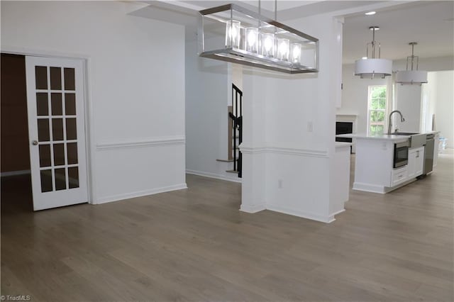 6215 Glen Way Dr, Winston-Salem, NC 27107 - unfurnished dining area featuring wood finished floors and a fireplace