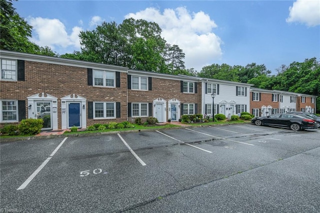 311 Salisbury St Unit 50, Kernersville, NC 27284 - view of front of house with uncovered parking and brick siding