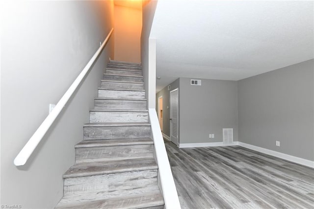 311 Salisbury St Unit 50, Kernersville, NC 27284 - stairs featuring wood finished floors and baseboards