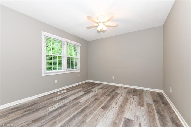 311 Salisbury St Unit 50, Kernersville, NC 27284 - spare room with ceiling fan, wood finished floors, and baseboards