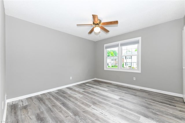 311 Salisbury St Unit 50, Kernersville, NC 27284 - spare room featuring baseboards, ceiling fan, and wood finished floors