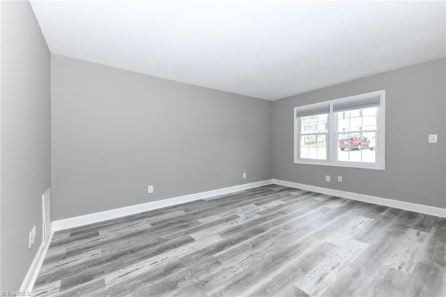 311 Salisbury St Unit 50, Kernersville, NC 27284 - spare room featuring wood finished floors and baseboards