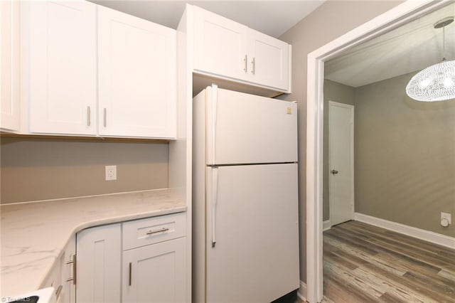 311 Salisbury St Unit 50, Kernersville, NC 27284 - kitchen featuring freestanding refrigerator, white cabinets, wood finished floors, and a chandelier