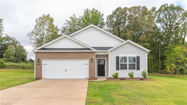 view of front of property with a front yard and a garage