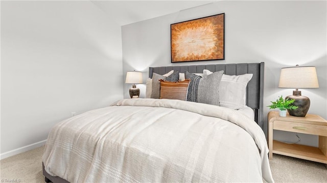 bedroom featuring lofted ceiling and carpet