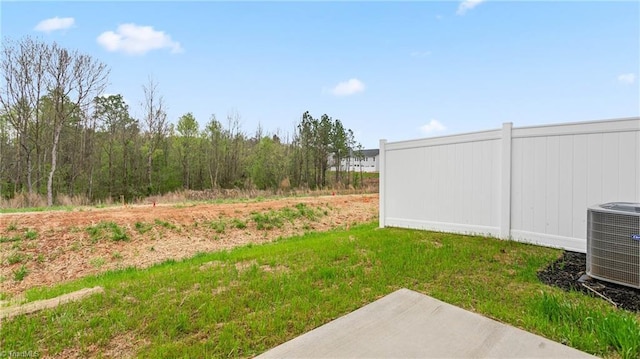 view of yard featuring central AC