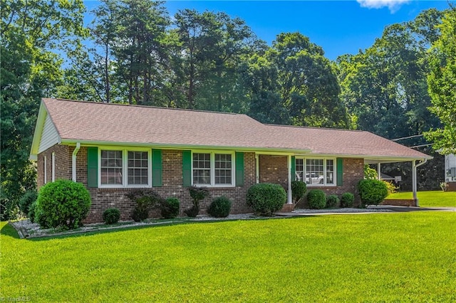 213 Timmys Ln, King, NC 27021 - ranch-style home featuring brick siding, a front lawn, and roof with shingles