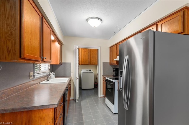 213 Timmys Ln, King, NC 27021 - kitchen featuring stainless steel fridge, white electric range, washer / clothes dryer, brown cabinets, and a textured ceiling