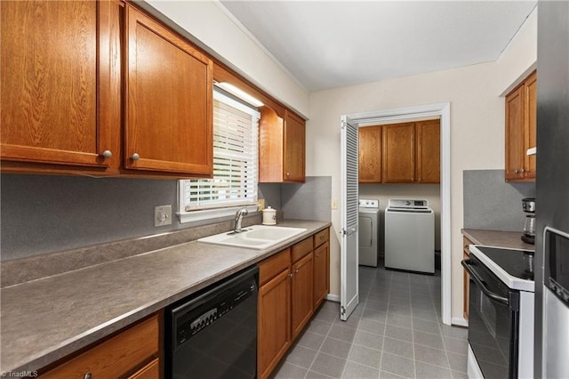 213 Timmys Ln, King, NC 27021 - kitchen with range with electric stovetop, black dishwasher, washer and clothes dryer, and brown cabinetry