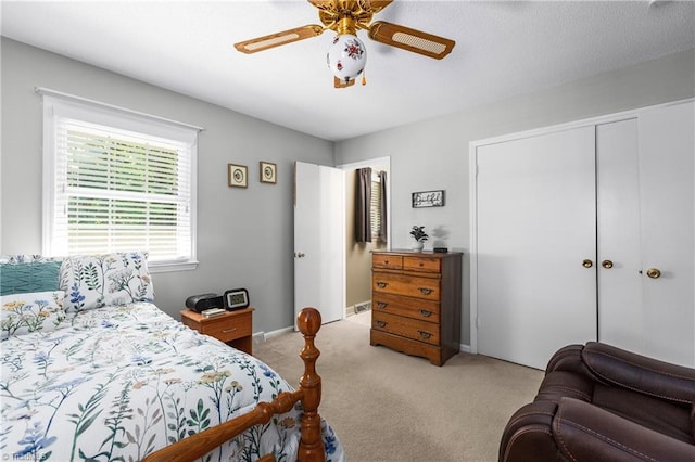 213 Timmys Ln, King, NC 27021 - bedroom with light carpet, a closet, and ceiling fan