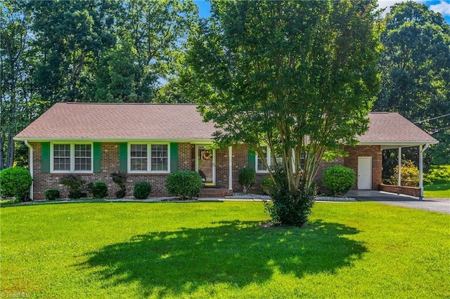 213 Timmys Ln, King, NC 27021 - view of front facade with driveway, a front lawn, and brick siding