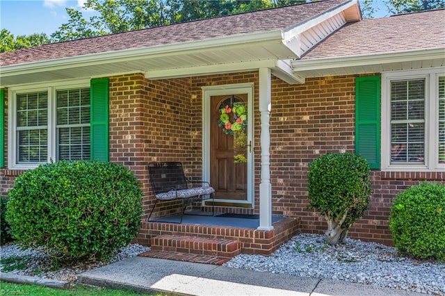 213 Timmys Ln, King, NC 27021 - view of exterior entry with brick siding and a shingled roof
