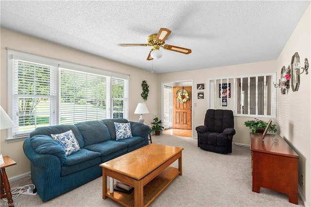 213 Timmys Ln, King, NC 27021 - living area featuring plenty of natural light, a ceiling fan, a textured ceiling, and carpet