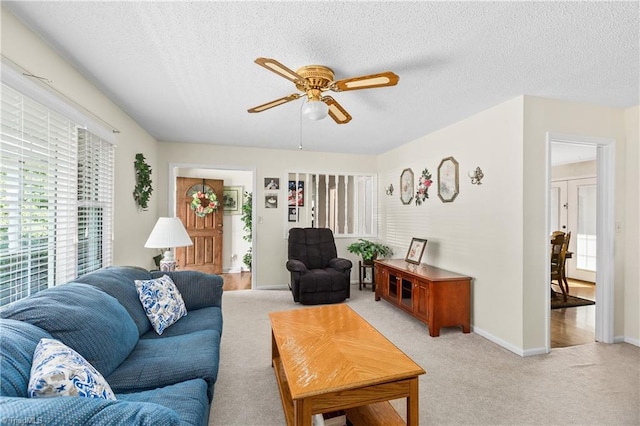 213 Timmys Ln, King, NC 27021 - living room with ceiling fan, a textured ceiling, and light colored carpet