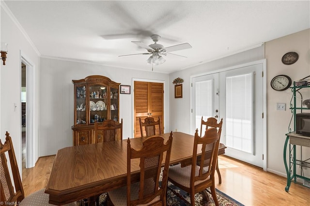 213 Timmys Ln, King, NC 27021 - dining room featuring a ceiling fan, light wood-type flooring, ornamental molding, and french doors