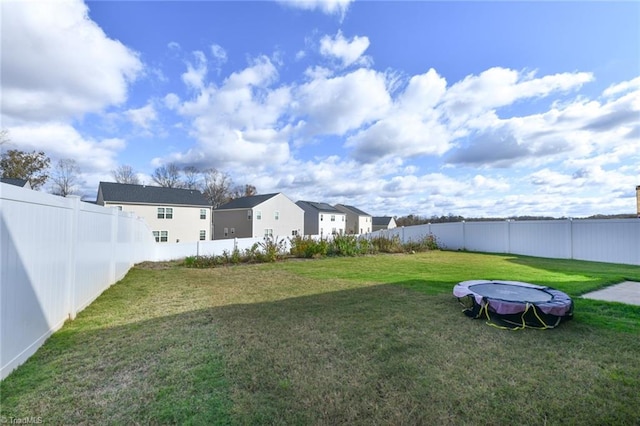 view of yard with a trampoline