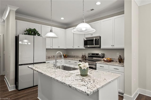 kitchen with white cabinetry, a sink, a kitchen island with sink, and appliances with stainless steel finishes