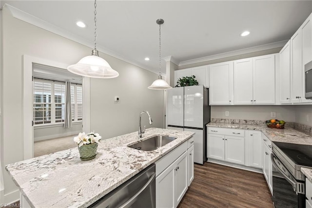 kitchen featuring white cabinets, ornamental molding, dark wood finished floors, appliances with stainless steel finishes, and a sink