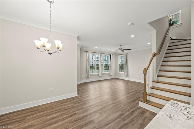 unfurnished living room featuring baseboards, crown molding, stairs, and dark wood-type flooring