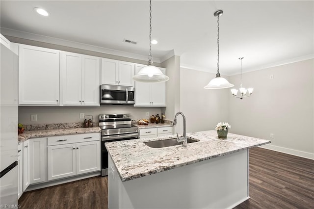 kitchen with a sink, appliances with stainless steel finishes, dark wood finished floors, visible vents, and ornamental molding