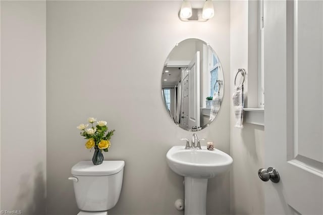 bathroom with toilet and a sink