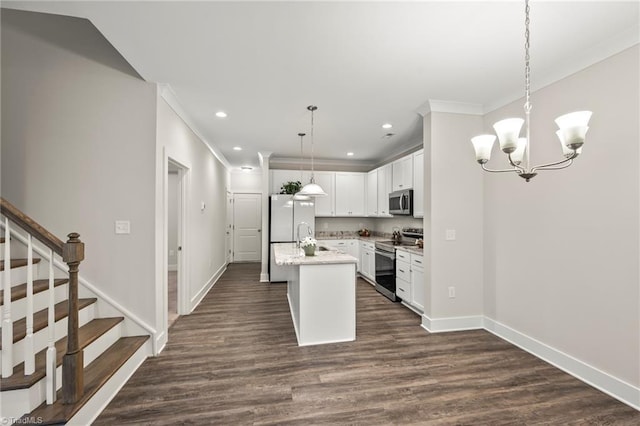 kitchen with crown molding, baseboards, dark wood finished floors, a center island with sink, and appliances with stainless steel finishes