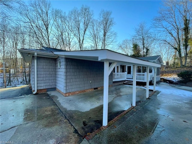 view of property exterior featuring a porch