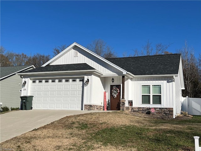 view of front of home with a front lawn and a garage