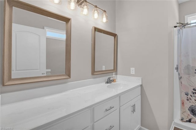 bathroom featuring vanity and walk in shower