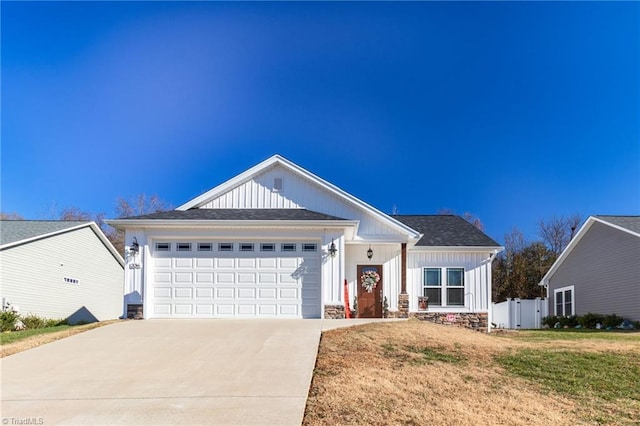 view of front of home featuring a garage and a front lawn