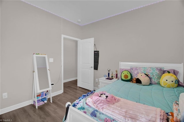 bedroom featuring dark hardwood / wood-style flooring