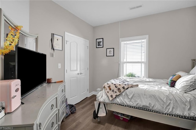 bedroom with hardwood / wood-style flooring