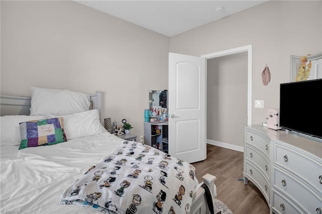 bedroom featuring hardwood / wood-style floors