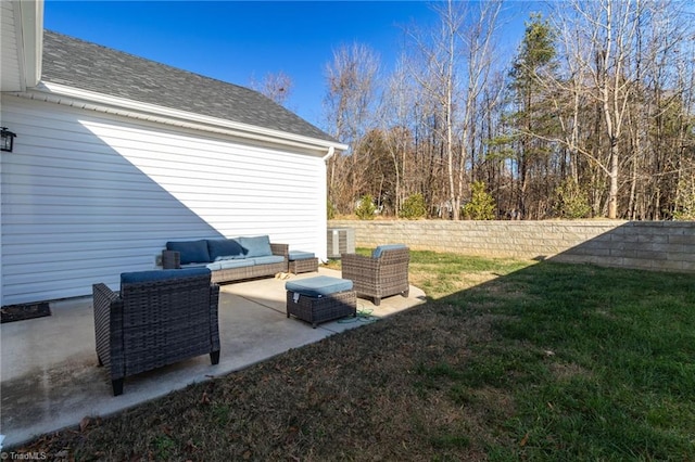 view of yard with central AC unit, an outdoor living space, and a patio area