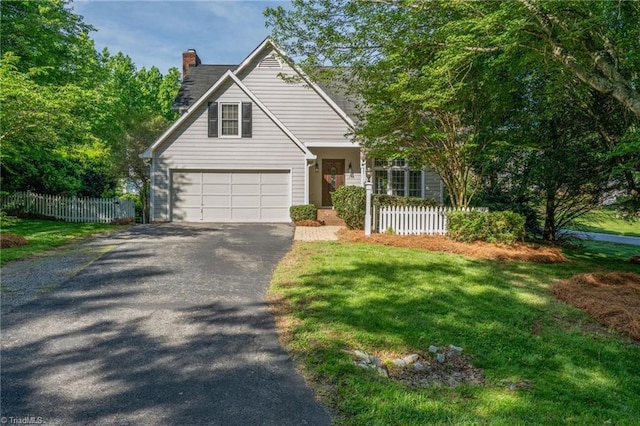 201 Saint Regis Ln, Kernersville, NC 27284 - traditional-style home with asphalt driveway, a chimney, and a garage