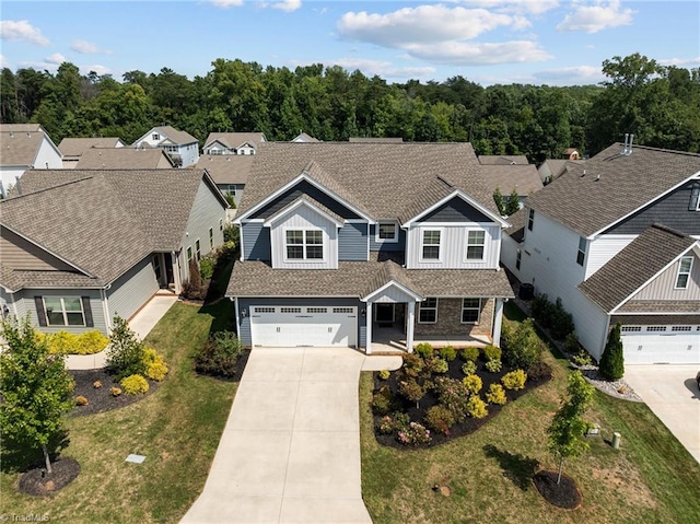 view of front of home with a front yard and a garage